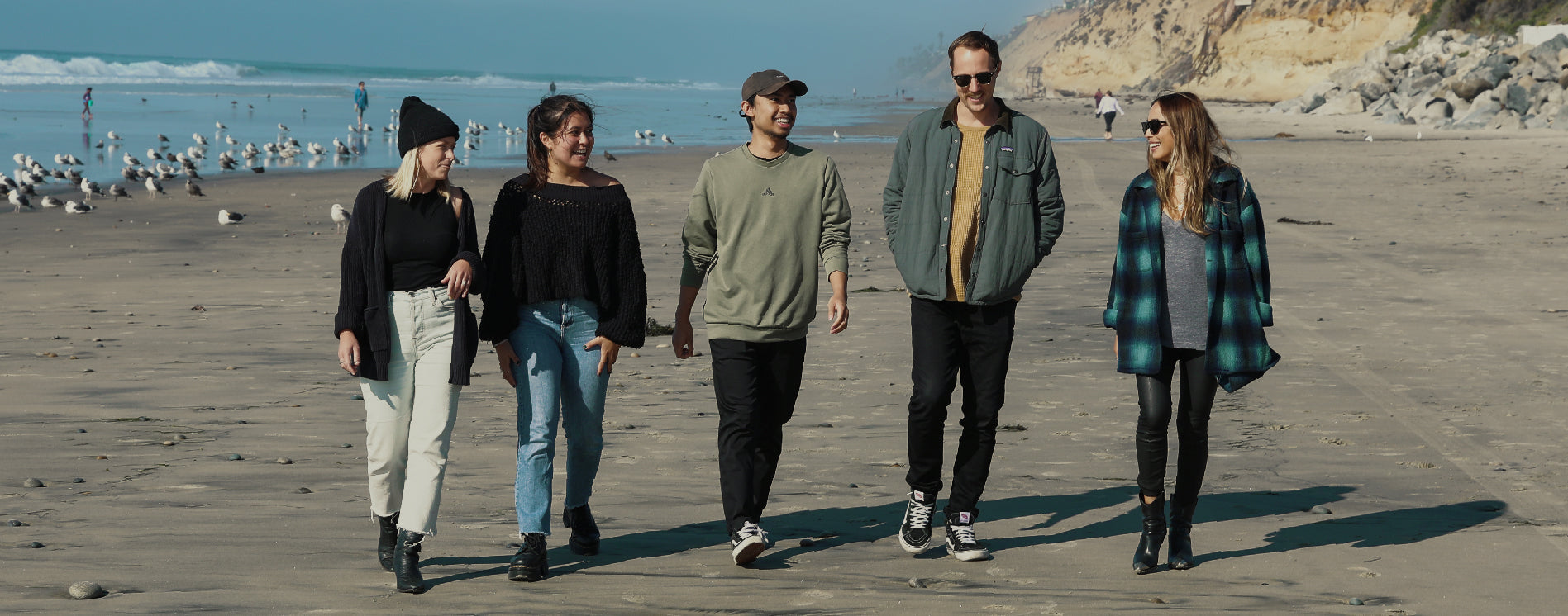 Sun Bum crew walking on the beach